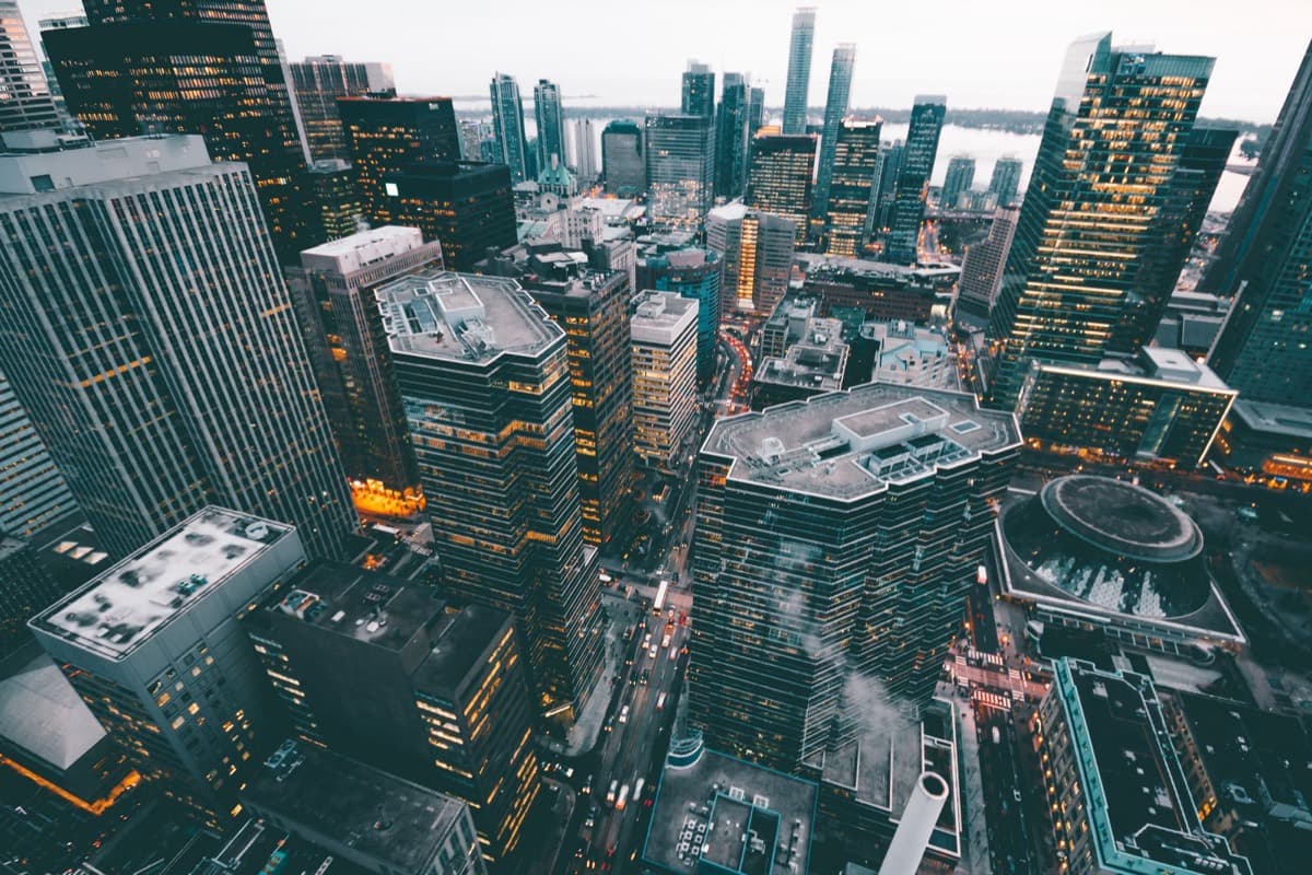 Aerial view of commercial buildings in a city at dusk